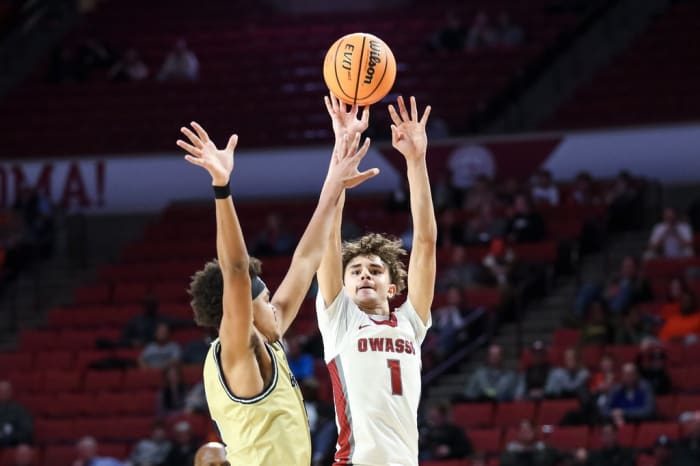 Owasso's Jalen Montonati (1) shoots a three during a boys high school basketball semifinals game in the state tournament between Owasso and Broken Arrow at the Lloyd Noble Center in Norman, Okla., on Friday, March 10, 2023.